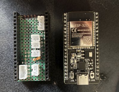 A photo of the LinkLite perfboard next to the ESP-32D board.